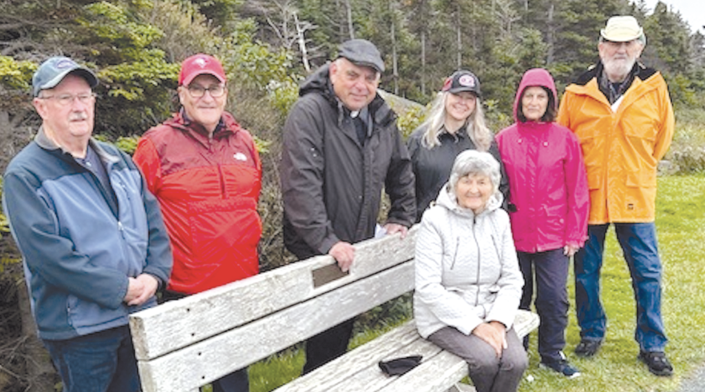 people enjoying a break while on a prayer walk in Upper Gullies, Newfoundland.
